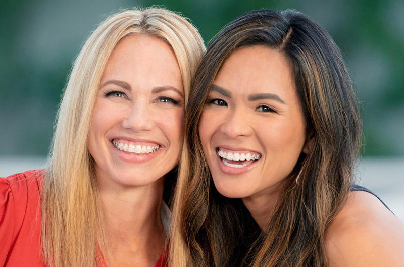 Two women smiling with Damon braces